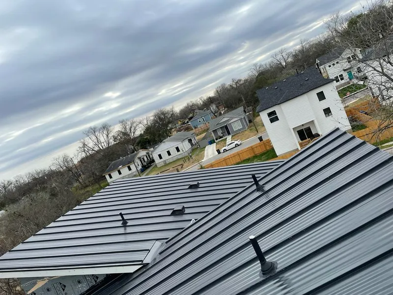 Standing seam metal roof panels with vents for Skylight Repair in Beverly